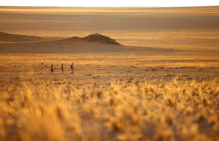 Sossusvlei desert lodge experience walking guide and guests